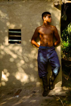 When Ciriaco Muñoz died, he left nothing more than a machete (now rusty) and a pair of work pants. Here, his son, Olvin Muñoz López is wearing his father's pants. Eventually, he will have to decide between leaving (like his older sister who lives in Tegucigalpa and works in a tortilla factory) or staying in the region and working on the oil palm plantations (possibly as an employee of one of the large landowners). He commented that neither option seems very promising.